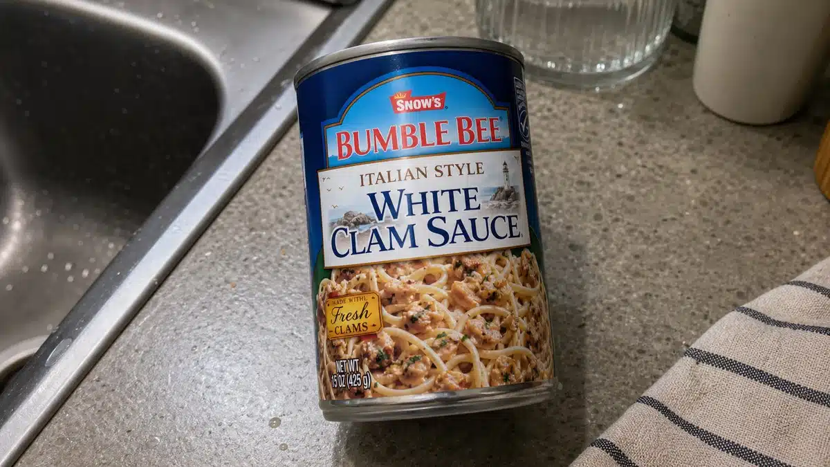 AI product-style photo of Snow's Italian Style White Clam Sauce for best canned clam sauce