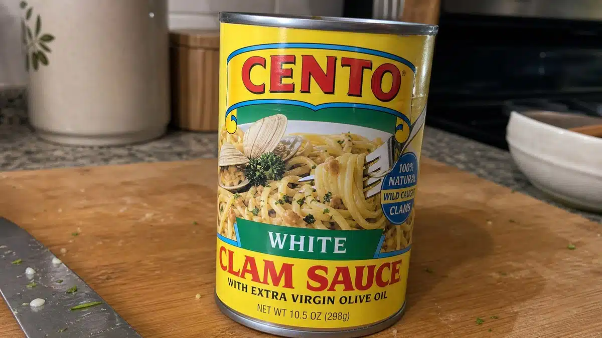 AI product-style photo of Cento White Clam Sauce with Extra Virgin Olive Oil for best canned clam sauce