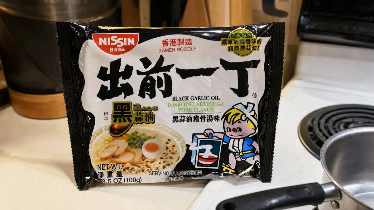 AI product-style photo of Nissin Demae Black Garlic Oil Tonkotsu for best instant ramen