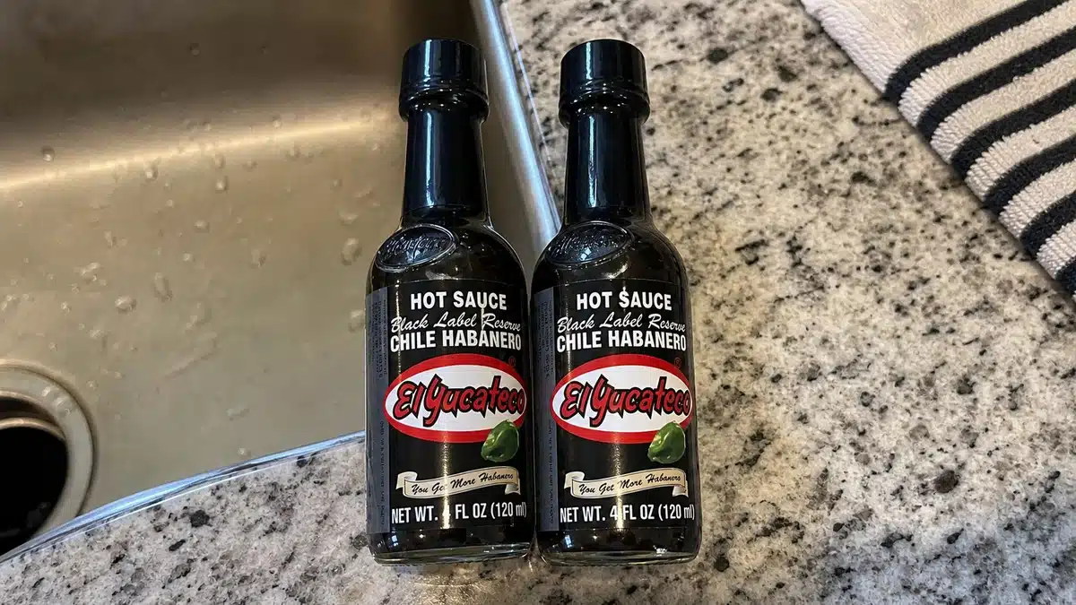 AI product-style photo of El Yucateco Black Label Reserve Habanero Hot Sauce for best mexican hot sauce