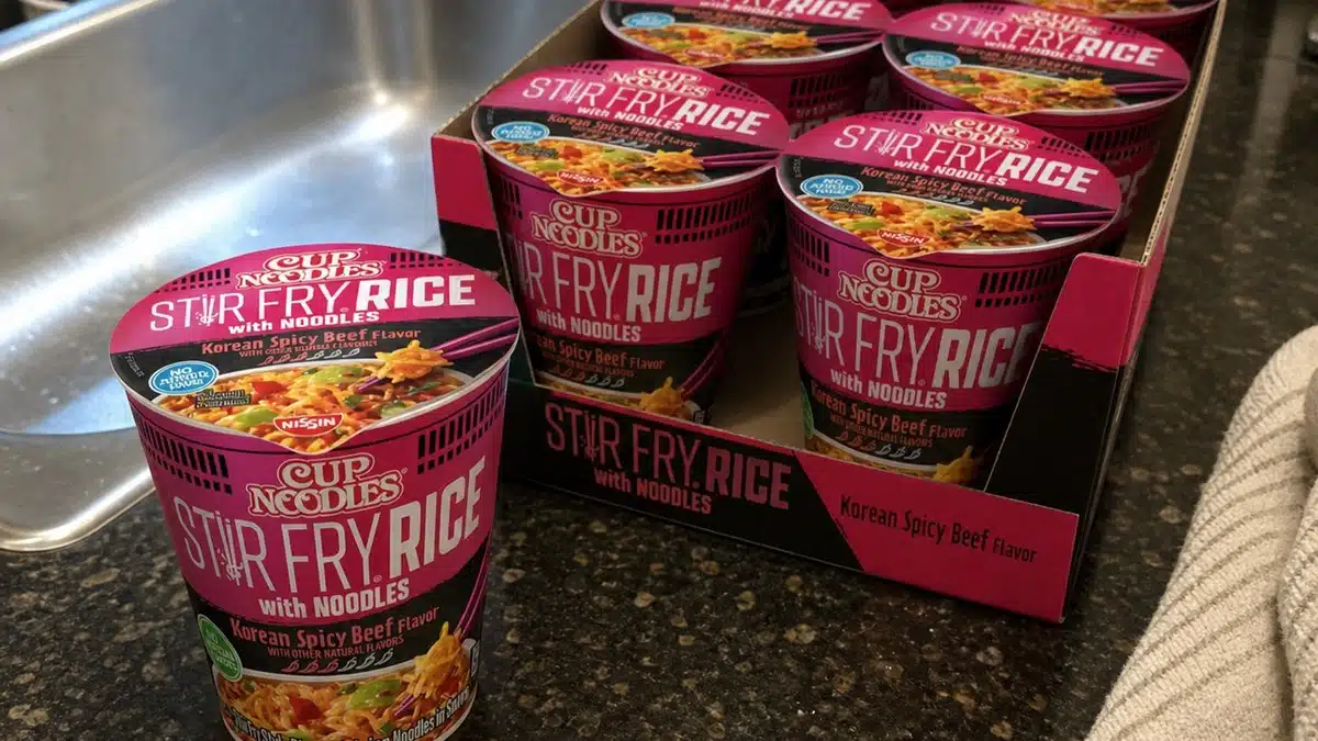 AI product-style photo of Nissin Cup Noodles Stir Fry Rice with Noodles Korean Spicy Beef for best nissin cup noodles flavors