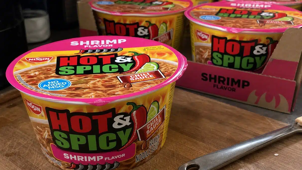 AI product-style photo of Nissin Hot & Spicy Ramen Noodle Soup with Shrimp for best nissin cup noodles flavors