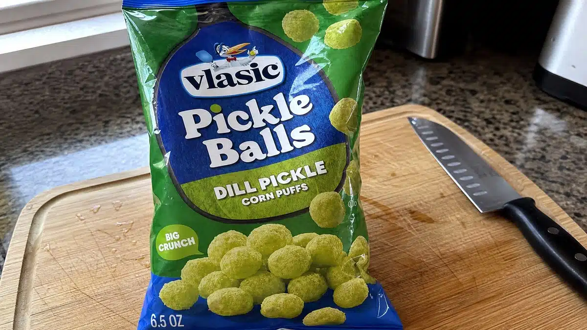 AI product-style photo of Vlasic Pickle Balls Dill Pickle Corn Puffs for best pickle flavored snacks